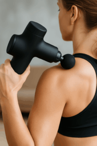 a woman holding a device on her shoulder